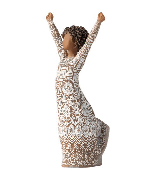 7 inchH Courageous Joy. Willow Tree figurine by Susan Lordi . A Unique figurine with darker skin and natural hairstyle, wearing a dress with etched textile patterns, raises her arms in uplifting gesture. A gift to offer support during a friend’s or family member’s healing process; a daily reminder of one’s courage and strength. Sentiment: Courage to be seen, to be heard, to be healed