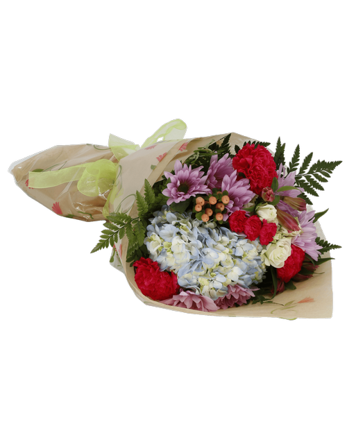 Hand-tied bouquet including a hydrangea, spray roses, carnations, mini carnations, alstroemeria, daisy poms, and hypericum.