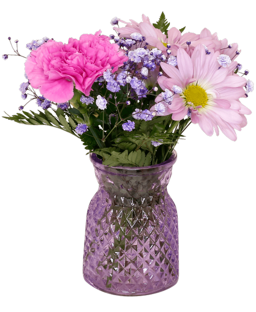 A 4.5 inchH lavender glass vase with a diamond pattern holds an all-around arrangement with a carnation, daisy poms, and purple-dyed baby's breath. 7 inchH x 6 inchW