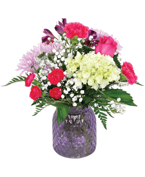 A 6.5 inchH lavender glass vase with a diamond pattern holds an all-around arrangement with a rose, a mini hydrangea, carnations, mini carnations, daisy poms, alstroemeria, and baby's breath. 14 inchH x 10 inchW