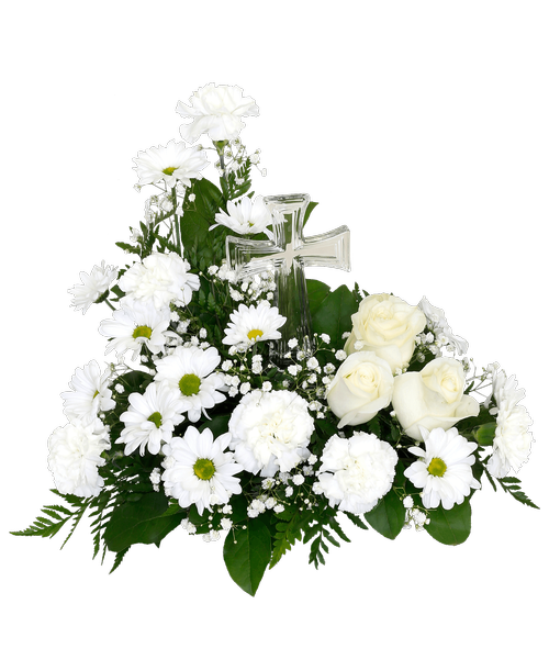 An 8.5 inchH glass cross surrounded by an arrangement with white flowers including three roses, carnations, daisy poms, and babies breath. 13 inchH x 14 inchW