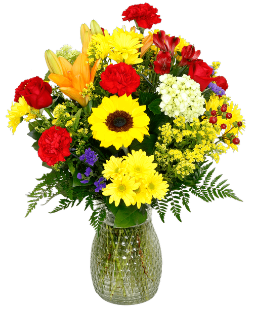 A 10 inch pebbled glass vase holds an all-around arrangement with five roses, sunflowers, lilies, mini green hydrangea, alstroemeria, carnations, daisy poms, hypericum, statice, and solidago. 26 inchH x 16 inchW