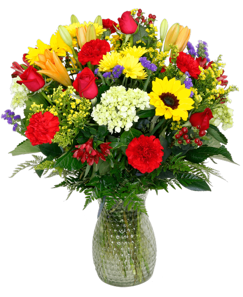 A 10 inch pebbled glass vase holds an all-around arrangement with five roses, sunflowers, lilies, mini green hydrangea, alstroemeria, carnations, daisy poms, hypericum, statice, and solidago. 24 inchH x 16 inchW