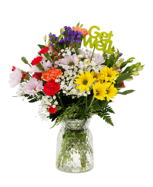 A 6.5 inchH clear glass vase with a diamond pattern holds an all-around arrangement with charmelia alstroemeria, carnations, mini carnations, daisy poms, baby's breath, and statice. Decorated with a inchGet Well Soon inch stick in. 16 inchH x 12 inchW