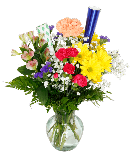 A 6.75 inchH clear vase holds an all-around arrangement including carnations, mini carnations, daisy poms, charmelia alstroemeria, baby's breath, and statice. Decorated with a party horn and noise maker. 15 inchH x 9 inchW; 17 inchH to top of horn