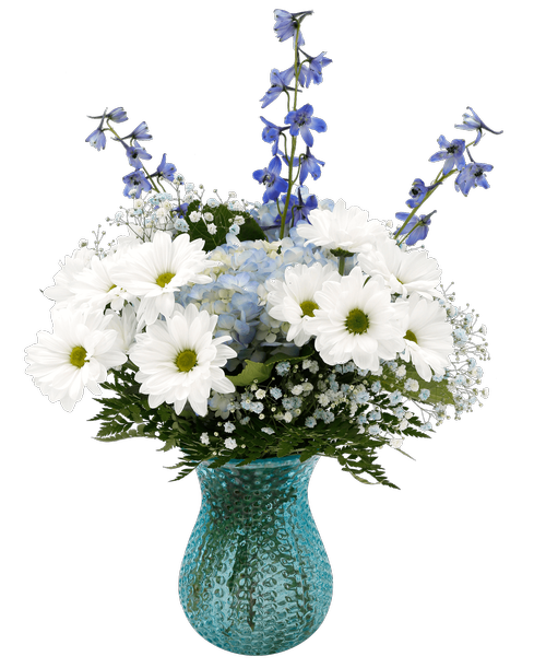 A 7.5 inch blue dimpled glass vase holds an all around arrangement with delphinium, daisy poms, blue hydrangea, and blue dyed baby's breath. 15 inchH x 13 inchW overall 22 inchH