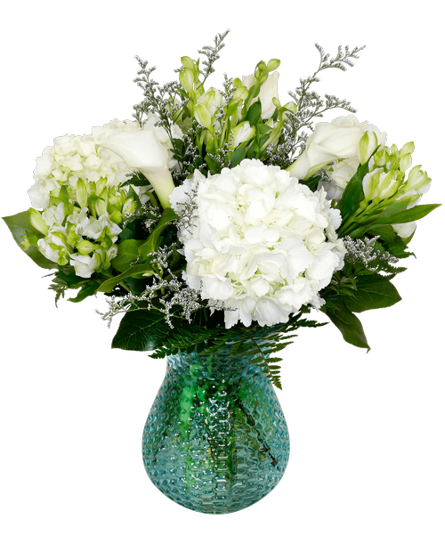 A 7.5 inch blue dimpled glass vase holds an all-around arrangement with hydrangea, mini calla lilies, white charmelia alstroemeria, and caspia. 17 inchH x 14 inchW