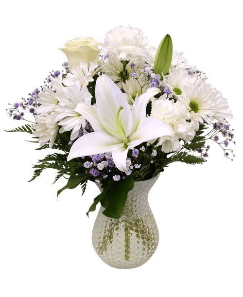 A 7 inch clear dimpled glass vase holds an all-around arrangement with white flowers including a rose, a lily, carnations, daisy poms, and purple dyed baby's breath. 16 inchH x 12 inchW