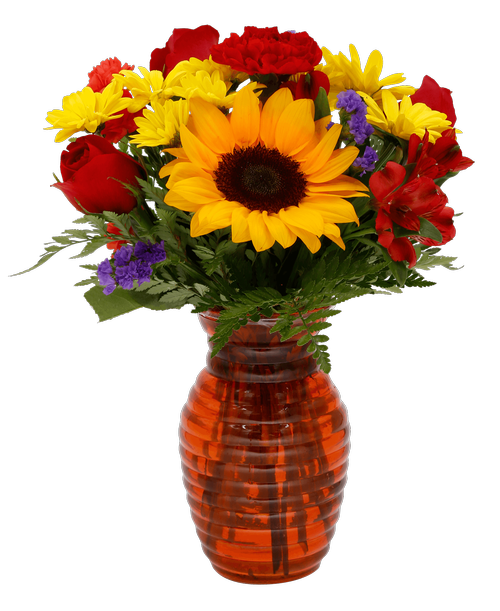 A 7.25 inchH orange glass vase with a horizontal design holds an all around arrangement with three roses, a sunflower, a carnation, alstroemeria, daisy poms, mini carnations, and statice. 15 inchH x 10 inchW