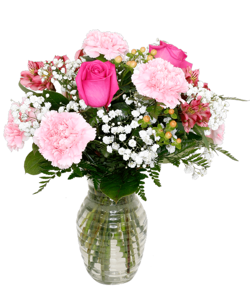 A 7.25 inchH clear glass vase with a horizontal design holds an all-around arrangement in shades of pinks with two roses, carnations, alstroemeria, hypericum, and baby's breath. 16 inchH x 14 inchW