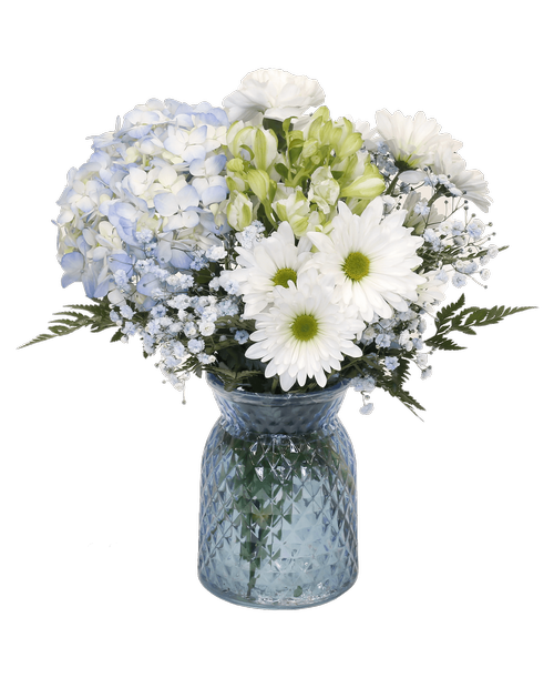 A 6.5 inchH blue glass vase with a diamond pattern holds an all-around arrangement with a hydrangea, charmelia alstroemeria, carnations, daisy poms, and blue-dyed baby's breath. 14.5 inchH x 9.5 inchW