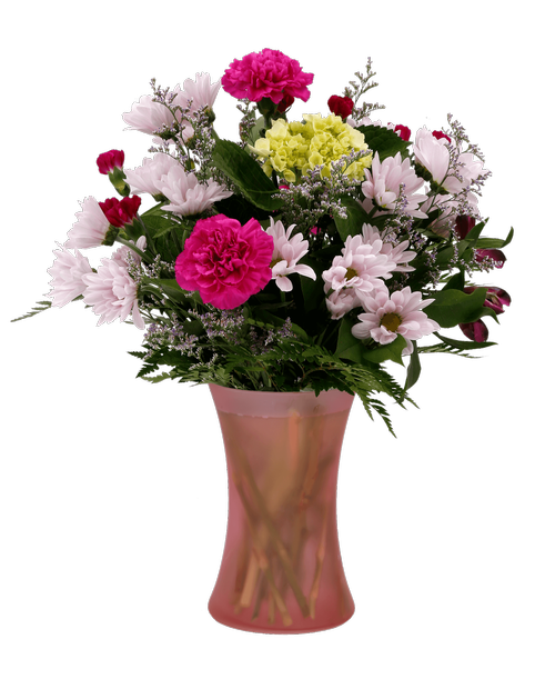 A 7.5 inch pink dimpled glass vase holds an all-around arrangement with a mini green hydrangea, carnations, mini carnations, alstroemeria, daisy poms, and caspia. 17.5 inchH x 12 inchW