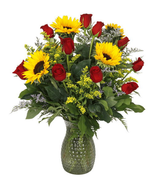 A 10 inch pebbled glass vase holds an all-around arrangement with a dozen red roses, sunflowers, solidago, and caspia. 28 inchH x 19 inchW