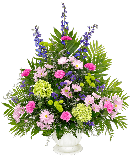 A one-sided arrangement, suitable to be sent to a funeral or memorial service, with delphinium, carnations, mini green hydrangeas, daisy poms, button poms, caspia, and statice designed in a 9.5 inch Pedestal Urn. 29 inchH x 24 inchW; Overall 36 inchH