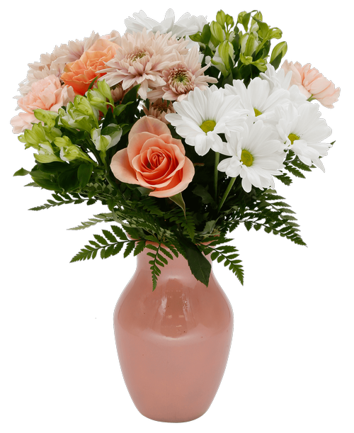 An 8 inch peach vase holds an all around arrangement with two peach roses, white charmelia alstroemeria, white daisy poms, peach carnations, and peach cushion poms. 16 inchH x 13 inchW