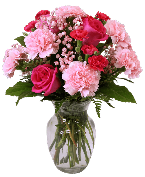 An 8 inchH clear glass vase holds an all around arrangement in shades of pinks with three roses, carnations, mini carnations, and baby's breath. 17 inchH x 12 inchW