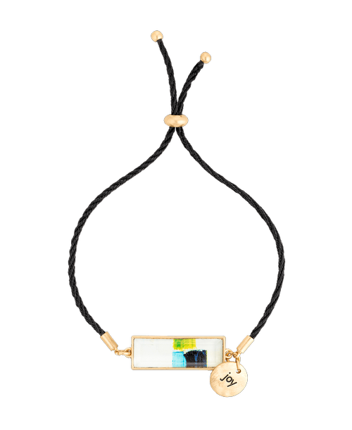 Incorporate inspiration throughout the day with the ArtLifting Bracelet-Isle of Skye. Crafted by a talented designer, this bracelet boosts multicolored imagery and an encouraging charm 'Joy', with an adjustable strap for easy wearing. A unique gift for her, or a little sweet something for yourself! Size: 1/4 inchw x 1 inchlong pendant with 5 inchlong chain (adjustable); Created by Charlie French