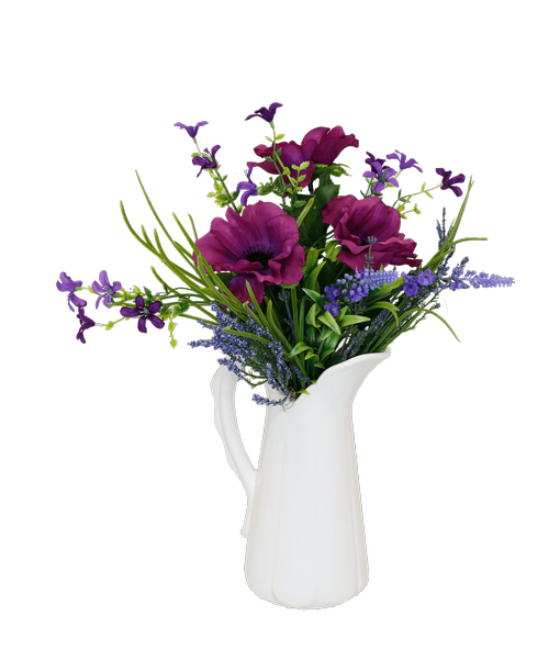 An 8.25 inchH white ceramic pitcher holds an all around silk arrangement including purple anemone. 15 inchH x 11.5 inchW