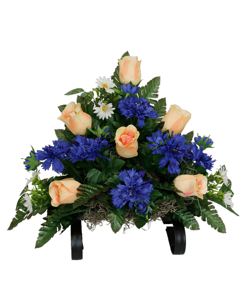 A cemetery gravestone saddle holds a one-sided silk arrangement with peach roses, and blue cornflower. 14 inchH x 18 inchW x 10.5 inchD
