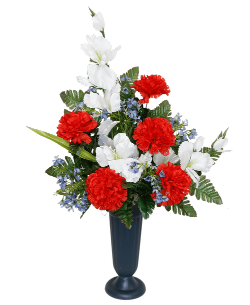 A plastic cemetery cup holds a one-sided silk arrangement with red, white and blue flowers, including carnations, gladiolus, and waxflower. 23 inchH x 17 inchW