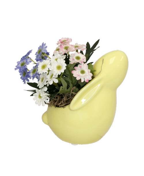 A 5.5 inchH yellow rabbit pottery holds a silk arrangement with pink, blue and white mini daisies. 6 inchH x 5.5 inchW