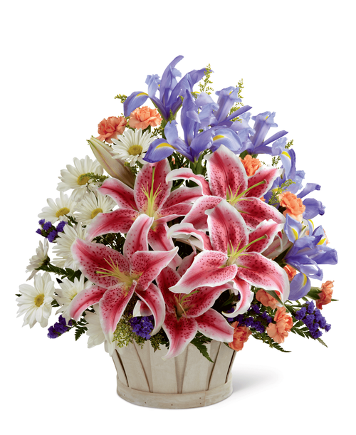 The FTD Wondrous Nature Bouquet is bountifully bedecked with a dazzling display of color and beauty. Stargazer lilies stretch their fuchsia petals out amongst an arrangement of blue iris, white traditional daisies, orange mini carnations, purple statice, and yellow solidago in a round whitewash handled basket, creating a delightful bouquet your special recipient will adore. 15 inchW x 17 inchH