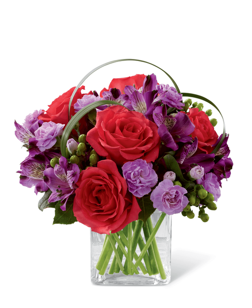 FTD proudly presents the Better Homes & Gardens Be Bold Bouquet. Blooming with bright colors to boldly express your every emotion, this exquisite flower bouquet is set to celebrate. Hot pink roses, purple Peruvian lilies, lavender mini carnations, green hypericum berries, lily grass blades and lush greens are brought together to create an incredible flower arrangement. Presented in a clear glass cube vase, this mixed flower bouquet will make that perfect impression on a birthday, anniversary, or as a way to extend your congratulations or thank you wishes. 10 inchW x 9 inchH