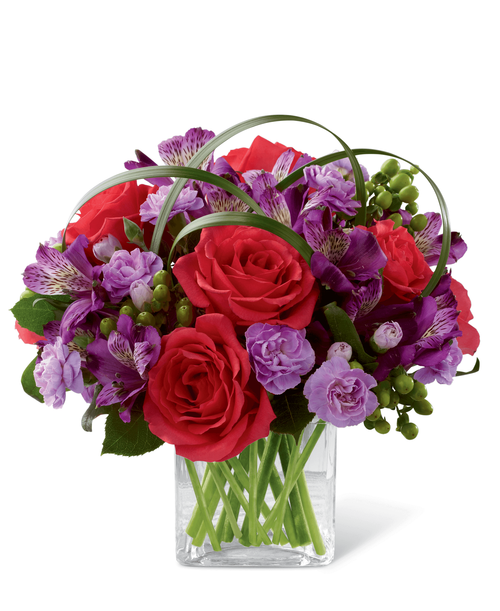 FTD proudly presents the Better Homes & Gardens Be Bold Bouquet. Blooming with bright colors to boldly express your every emotion, this exquisite flower bouquet is set to celebrate. Hot pink roses, purple Peruvian lilies, lavender mini carnations, green hypericum berries, lily grass blades and lush greens are brought together to create an incredible flower arrangement. Presented in a clear glass cube vase, this mixed flower bouquet will make that perfect impression on a birthday, anniversary, or as a way to extend your congratulations or thank you wishes. 11 inchW x 10 inchH