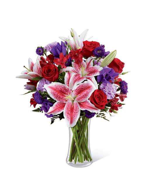 The FTD Stunning Beauty Bouquet is an absolutely lovely way to send your love and affection across the miles. Fragrant Stargazer lilies stretch their star-like petals across a bed of rich red roses, lavender carnations, red Peruvian lilies, purple double lisianthus, purple matsumoto asters and lush greens. Presented in a classic clear glass vase, this elegant bouquet is an incredible way to convey your sweetest sentiments. 16 inchW x19 inchH