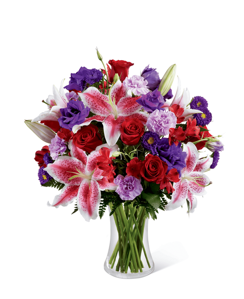 The FTD Stunning Beauty Bouquet is an absolutely lovely way to send your love and affection across the miles. Fragrant Stargazer lilies stretch their star-like petals across a bed of rich red roses, lavender carnations, red Peruvian lilies, purple double lisianthus, purple matsumoto asters and lush greens. Presented in a classic clear glass vase, this elegant bouquet is an incredible way to convey your sweetest sentiments. 17 inchW x20 inchH