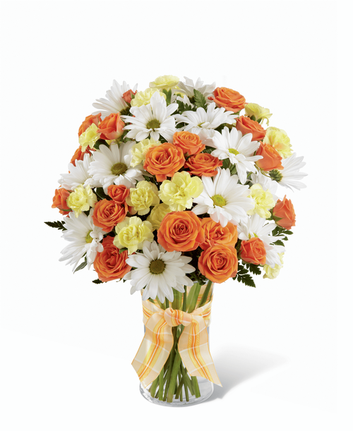 The FTD Sweet Splendor Bouquet radiates cheer and well-wishes with every sun-filled bloom! Orange spray roses, yellow mini carnations, white traditional daisies and lush greens are brought together in a classic clear glass vase accented with a designer apricot plaid ribbon to create a bouquet set to brighten any day. 11 inchW x 15 inchH