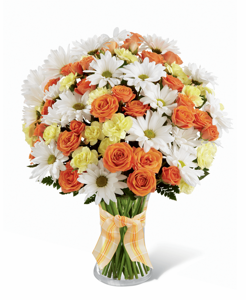 The FTD Sweet Splendor Bouquet radiates cheer and well-wishes with every sun-filled bloom! Orange spray roses, yellow mini carnations, white traditional daisies and lush greens are brought together in a classic clear glass vase accented with a designer apricot plaid ribbon to create a bouquet set to brighten any day. 13 inchW x 14 inchH