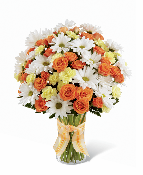 The FTD Sweet Splendor Bouquet radiates cheer and well-wishes with every sun-filled bloom! Orange spray roses, yellow mini carnations, white traditional daisies and lush greens are brought together in a classic clear glass vase accented with a designer apricot plaid ribbon to create a bouquet set to brighten any day. 12 inchW x 16 inchH