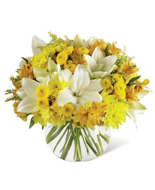 Make today their special day, lit with sun-kissed blooms and happy surprises. White Asiatic Lilies stretch their clean star-shaped petals across a bed of yellow Peruvian Lilies, chrysanthemums, button poms, and solidago accented with lush greens presented in a clear glass bubble bowl vase to create a flower bouquet blooming with warm wishes at every turn. A memorable thank you, birthday, or get well gift! Approx. 14 inchH x 15 inchW.
