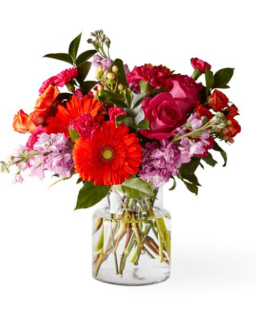 The Fiesta Bouquet is composed of a lively mix, fit to celebrate any and every moment. With a combination of vibrant flowers, this arrangement brings a pop of color and a burst of excitement as soon as it arrives. 17 inchHx16 inchW