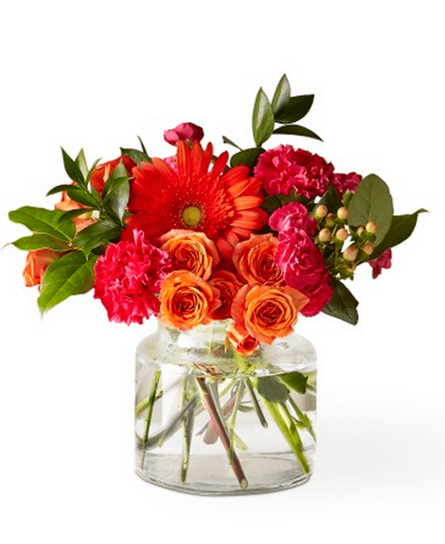 The Fiesta Bouquet is composed of a lively mix, fit to celebrate any and every moment. With a combination of vibrant flowers, this arrangement brings a pop of color and a burst of excitement as soon as it arrives. 12 inchHx12 inchW