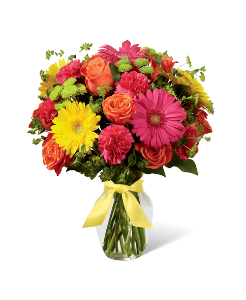 Celebrating life with colorful blooms that inspire and delight, this flower bouquet is ready to create a happy moment for your recipient that they will never forget. Orange roses, hot pink gerbera daisies, yellow gerbera daisies, hot pink carnations, green button poms, bupleurum, and lush greens mingle together to create a sunlit display while seated in a classic clear glass vase tied at the neck with a yellow satin ribbon for a sweet affect. A perfect get well, happy birthday, or congratulations gift! Approx. 17 inchH x 13 inchW