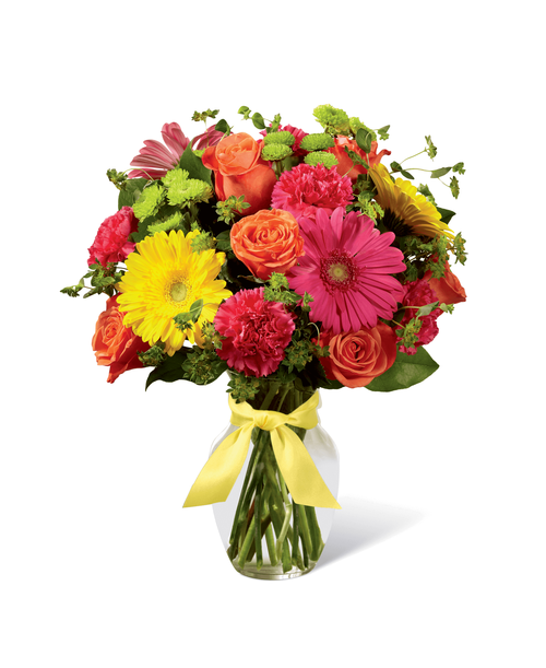 Celebrating life with colorful blooms that inspire and delight, this flower bouquet is ready to create a happy moment for your recipient that they will never forget. Orange roses, hot pink gerbera daisies, yellow gerbera daisies, hot pink carnations, green button poms, bupleurum, and lush greens mingle together to create a sunlit display while seated in a classic clear glass vase tied at the neck with a yellow satin ribbon for a sweet affect. A perfect get well, happy birthday, or congratulations gift! Approx. 16 inchH x 12 inchW