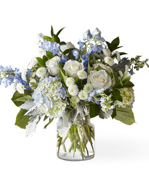 Let this uplifting arrangement be a reminder of the clear skies ahead. 18 inchHx22 inchW