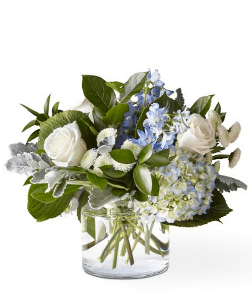 Let this uplifting arrangement be a reminder of the clear skies ahead. 15 inchHx18 inchW