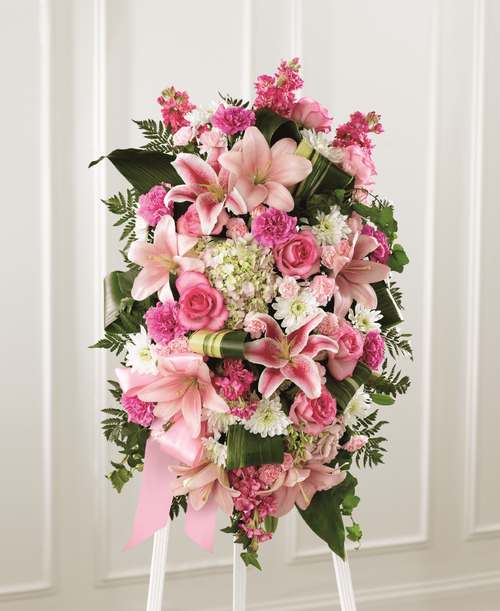 Our Comforting Standing Spray combines blushing blooms in a classic standing design t elegantly accent your messages of heartfelt sorrow. Crafted by a local florist, this grand tribute is a beautiful array of hydrangea, lilies, stock, roses and more. It makes a stunning display at any memorial service for the passing of a loved one. 
Good spray is approximately 30 inchH x 19 inchW 
Better spray is approximately 31 inchH x 20 inchW 
Best spray is approximately 32 inchH x 22 inchW