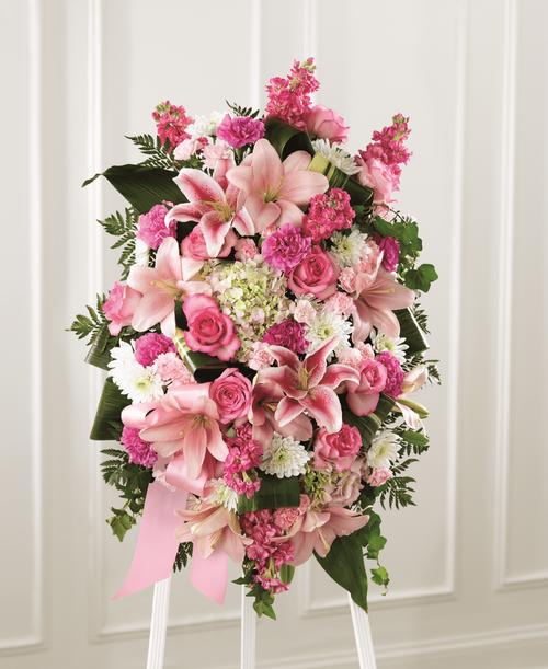 Our Comforting Standing Spray combines blushing blooms in a classic standing design t elegantly accent your messages of heartfelt sorrow. Crafted by a local florist, this grand tribute is a beautiful array of hydrangea, lilies, stock, roses and more. It makes a stunning display at any memorial service for the passing of a loved one. 
Good spray is approximately 30 inchH x 19 inchW 
Better spray is approximately 31 inchH x 20 inchW 
Best spray is approximately 32 inchH x 22 inchW