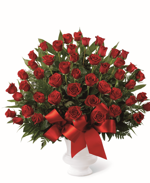 The FTD Soul's Splendor Arrangement is a rich display of the love shared throughout the life of the deceased. Brilliant red roses are elegantly displayed in a white designer plastic urn and accented with lush greens and red satin ribbon to create a beautiful tribute to honor your special relationship. 32 inchW x 32 inchH