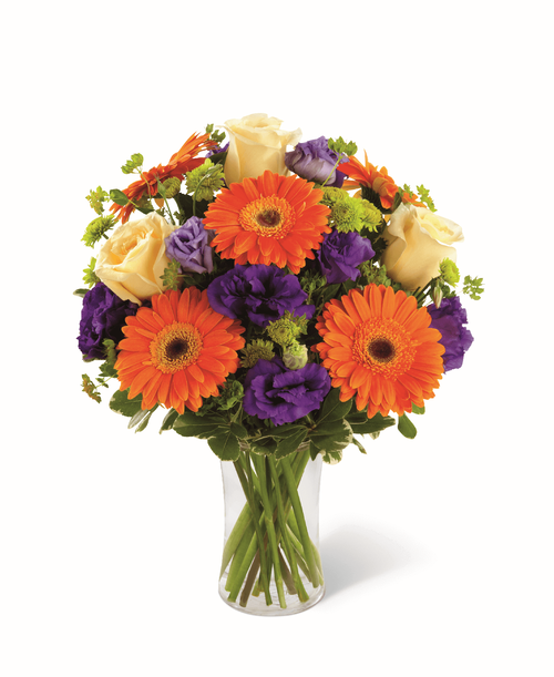 The FTD Rays of Solace Bouquet is a cheerful burst of color to extend your deepest sympathies. Crème de la Crème roses, orange gerbera daisies, purple lisianthus, green button poms and a mix of vibrant greens are beautifully arranged in a clear glass gathering vase to create a warm bouquet expressing hope with every colorful bloom. 15 inchW x 20 inchH