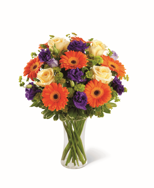 The FTD Rays of Solace Bouquet is a cheerful burst of color to extend your deepest sympathies. Crème de la Crème roses, orange gerbera daisies, purple lisianthus, green button poms and a mix of vibrant greens are beautifully arranged in a clear glass gathering vase to create a warm bouquet expressing hope with every colorful bloom. 13 inchW x 15 inchH
