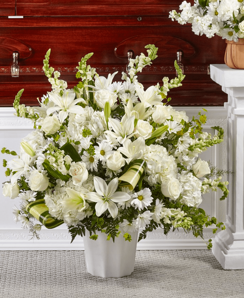 Comfort, beauty and grace come together in this stunning display of serene blooms. 32 inchHx32 inchW