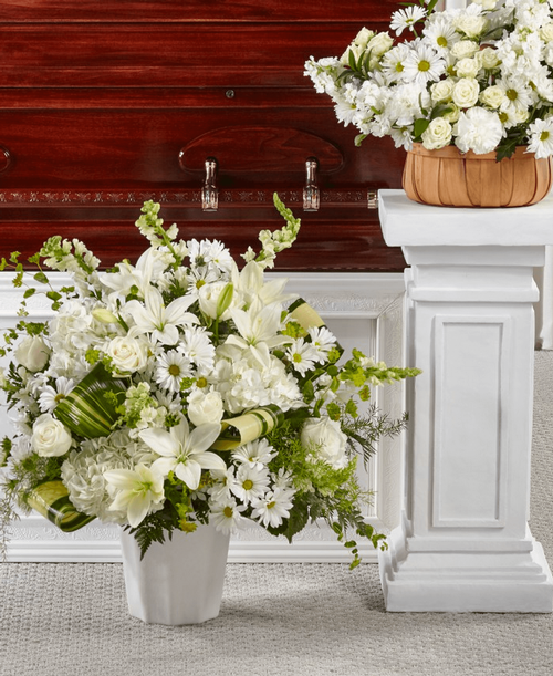 Comfort, beauty and grace come together in this stunning display of serene blooms. 30 inchHx27 inchW