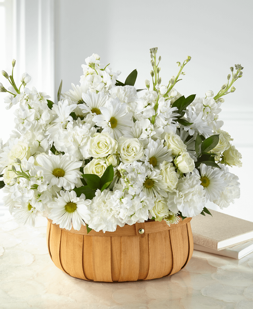 Elegant white flowers effortlessly capture your messages of support and love during the passing of a loved one. Our Graceful Garden Basket is handcrafted with stock, spray roses and carnations, with each bloom accented by a charming basket.
- Details:
Good basket is approximately 14 inchH x 17 inchW 
Better basket is approximately 16 inchH x 21 inchW 
Best basket is approximately 17 inchH x 25 inchW 