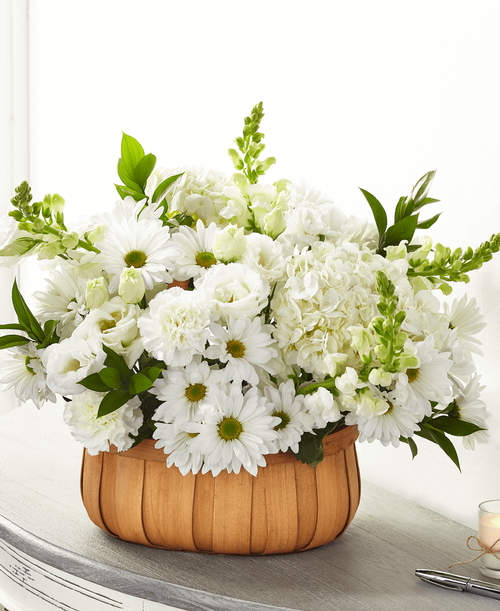 With our Pure Ivory Basket, share comfort and solace t your loved ones wh are going through a time of loss. Our local florists handcraft this basket of hydrangea, daisy pompons and snapdragons t share your messages of sympathy. 
- Detail: 
Good bouquet is approximately 14 inchH x 17 inchW 
Better bouquet is approximately 17 inchH x 19 inchW 
Best bouquet is approximately 19 inchH x 23 inchW 