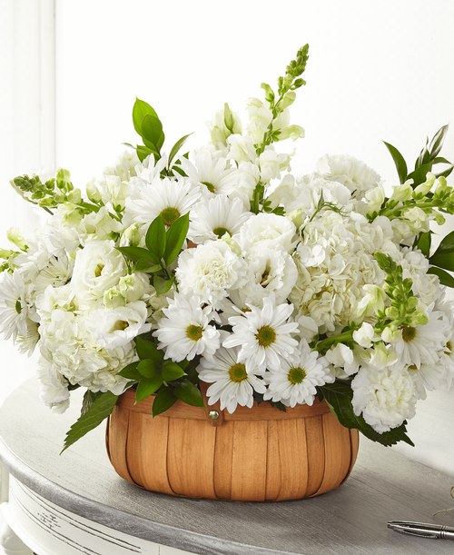 With our Pure Ivory Basket, share comfort and solace t your loved ones wh are going through a time of loss. Our local florists handcraft this basket of hydrangea, daisy pompons and snapdragons t share your messages of sympathy. 
- Detail: 
Good bouquet is approximately 14 inchH x 17 inchW 
Better bouquet is approximately 17 inchH x 19 inchW 
Best bouquet is approximately 19 inchH x 23 inchW 